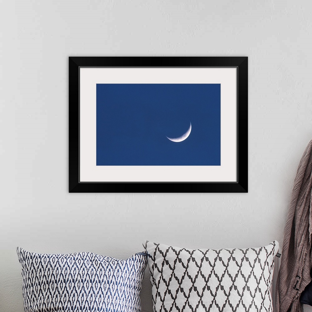 A bohemian room featuring Crescent moon in deep blue sky