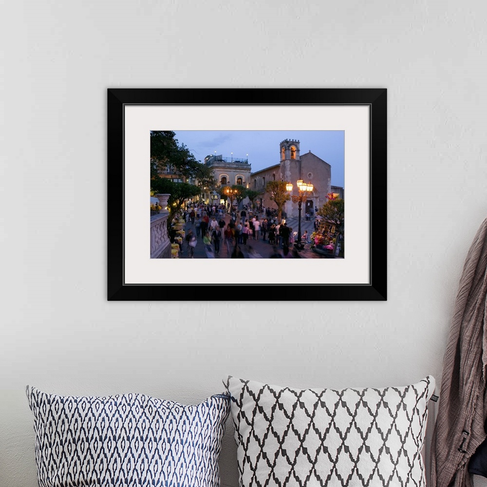 A bohemian room featuring Group of people on the street at dusk, Piazza IX Aprile, Taormina, Sicily, Italy