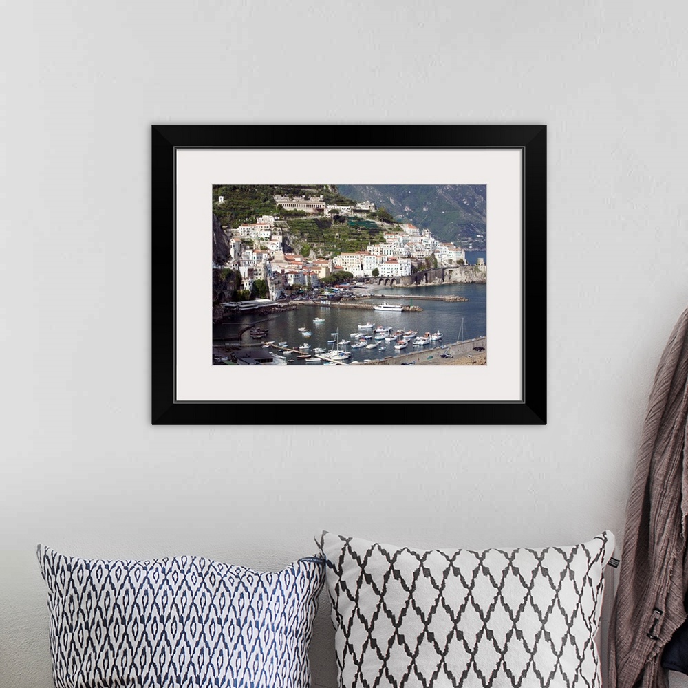 A bohemian room featuring Photograph of busy port town with boats coming in to dock.  Part of the water's edge is made of m...