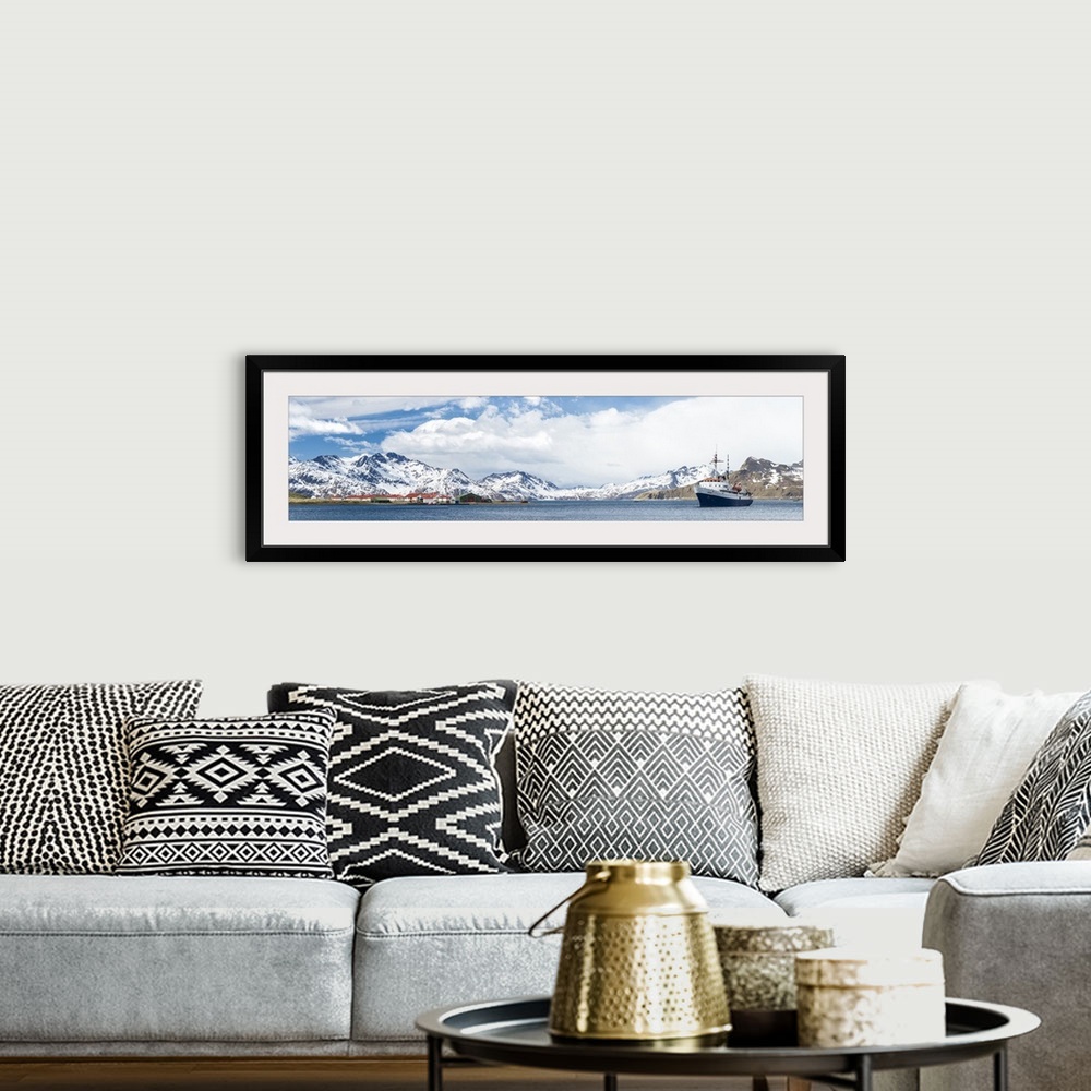 A bohemian room featuring MV Ushuaia tourist ship and the British base King Edward Point seen from Grytviken, South Georgia...