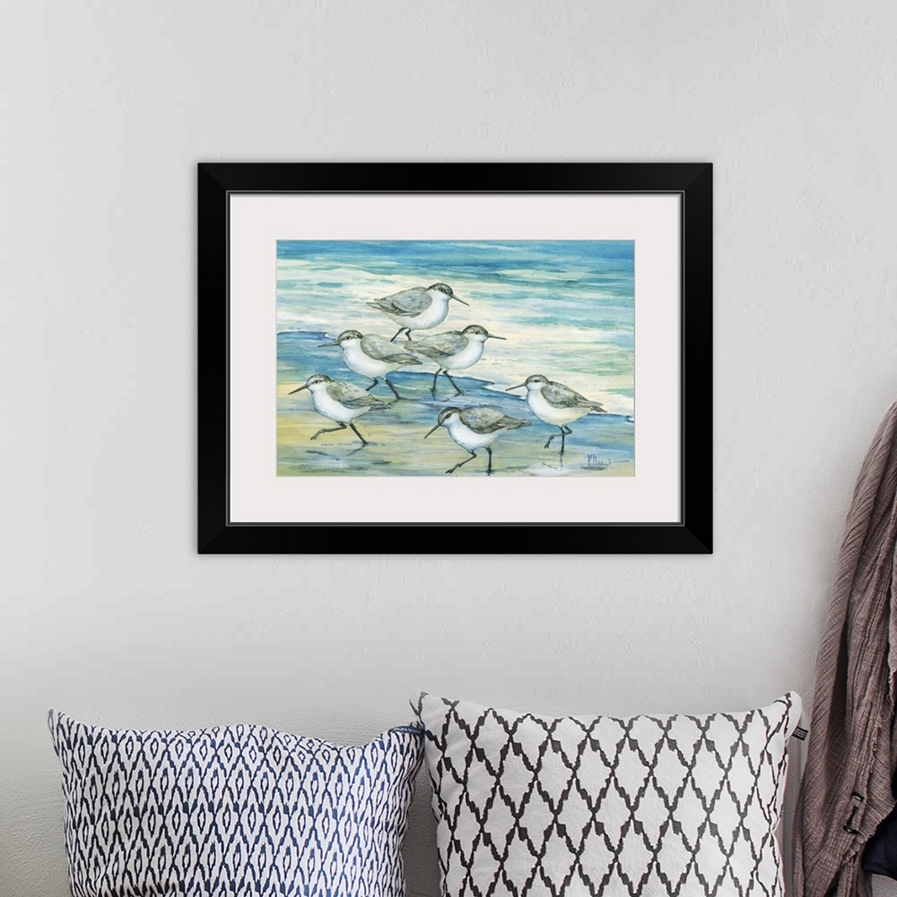 A bohemian room featuring Contemporary artwork of a flock of sandpiper birds on the beach.