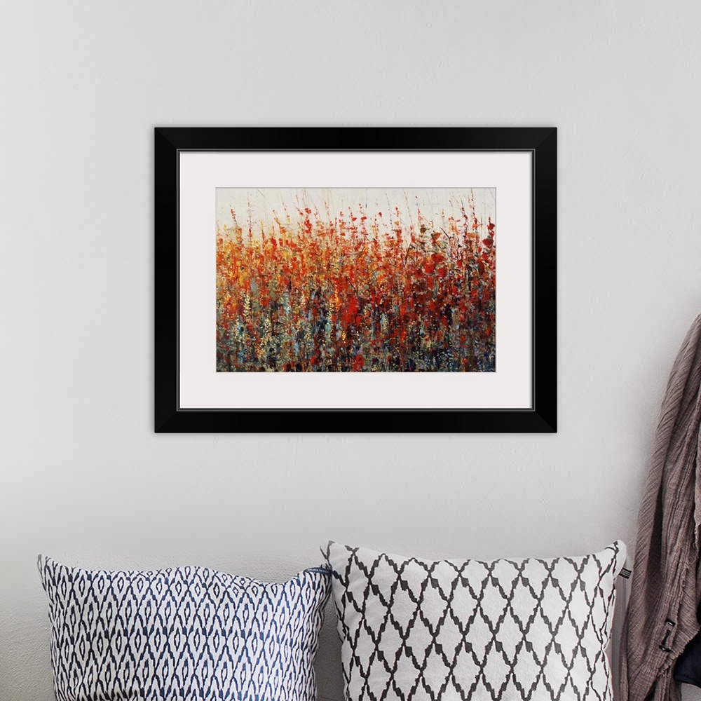A bohemian room featuring Contemporary painting of vibrant warm toned flowers.