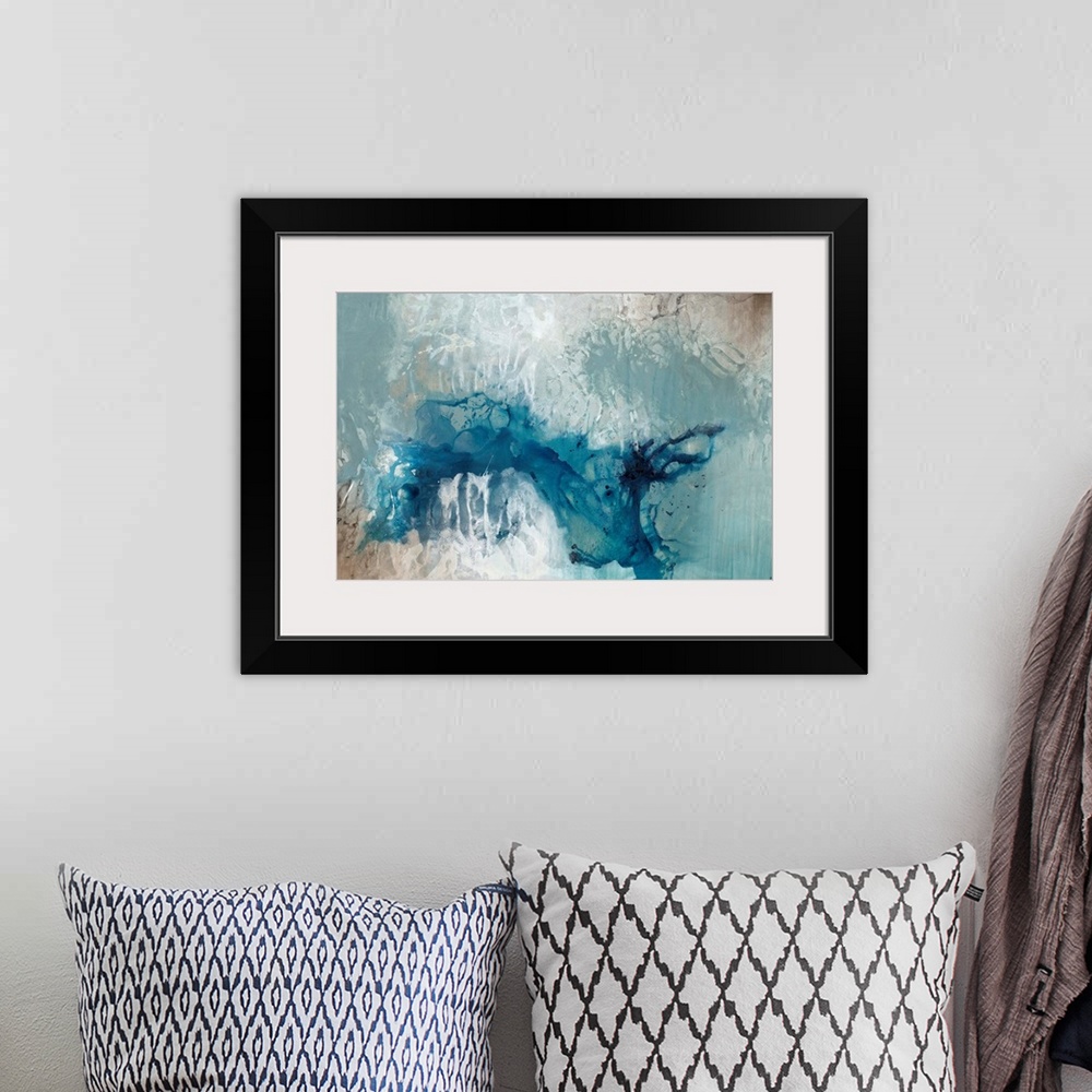 A bohemian room featuring Abstract painting dark teal splattered against a pale blue toned background.