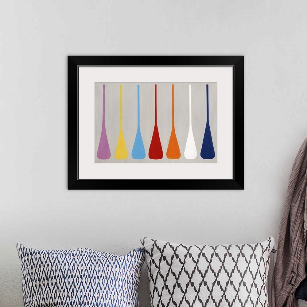 A bohemian room featuring Modern art of a row of similar multicolored shapes that resemble boat paddles, on a light, neutra...