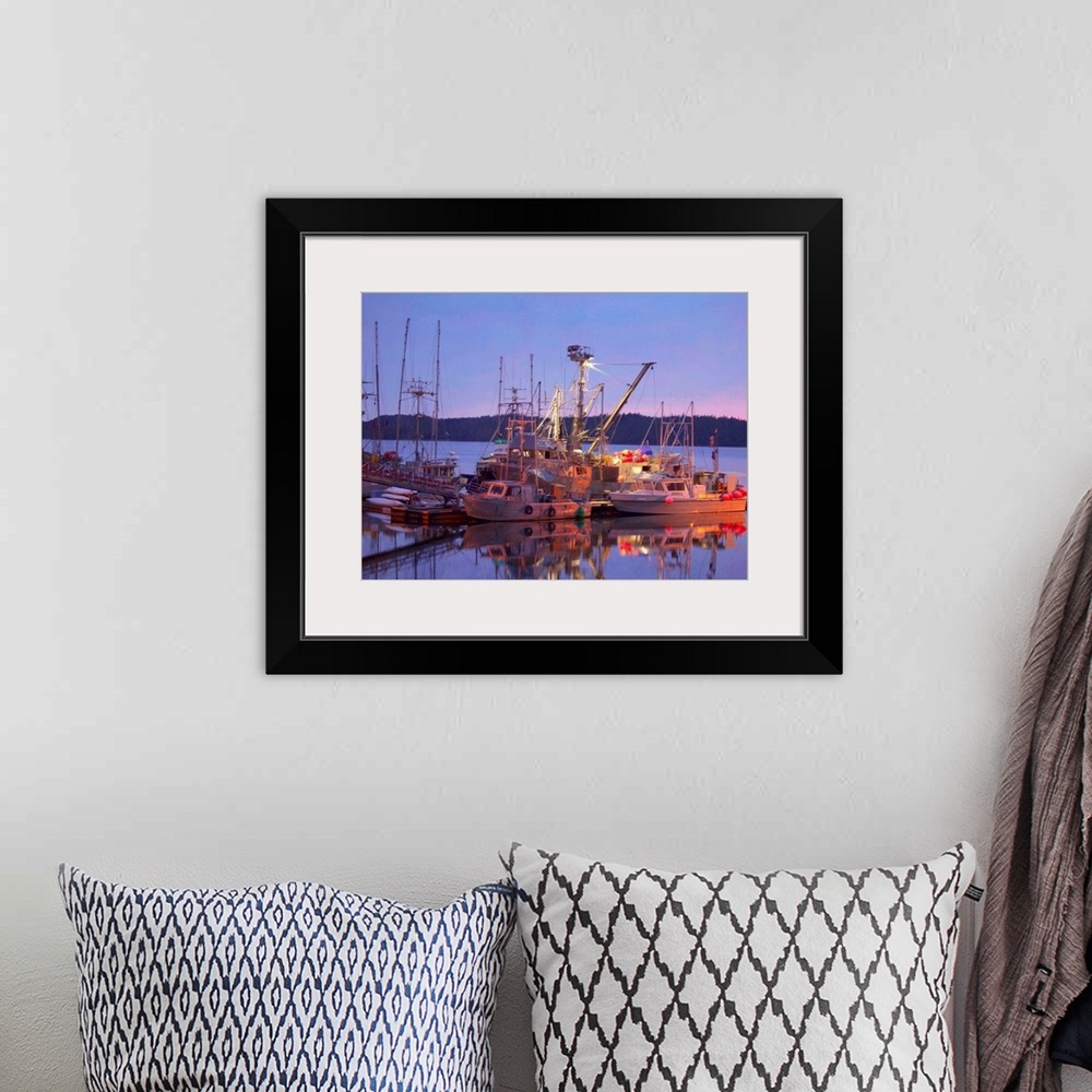 A bohemian room featuring Pictorialist photo of fishing boats reflected in the water while docked.