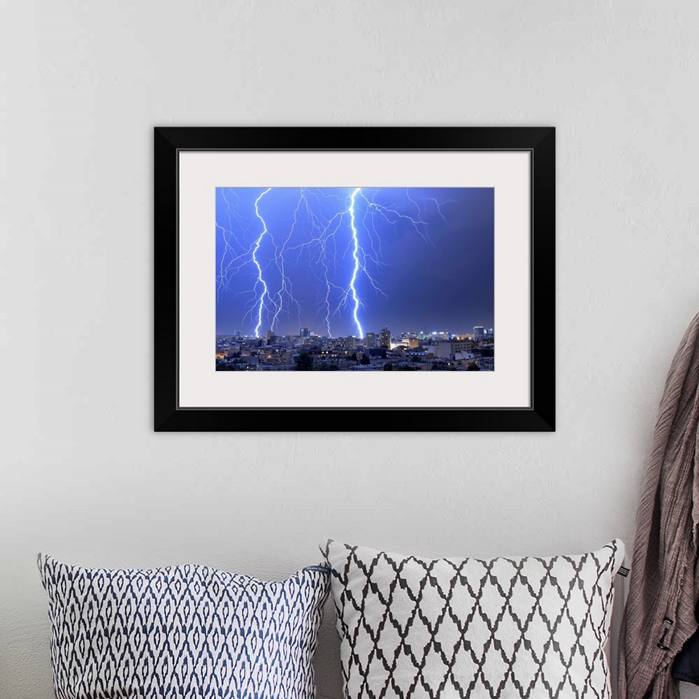 A bohemian room featuring Multiple exposures of lightning strikes over Bucharest, Romania.