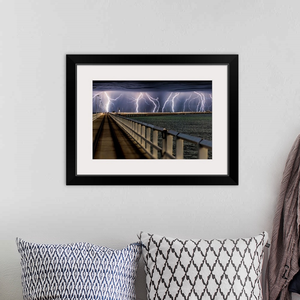 A bohemian room featuring Busselton Jetty, Western Australia, during an intense lightning storm.