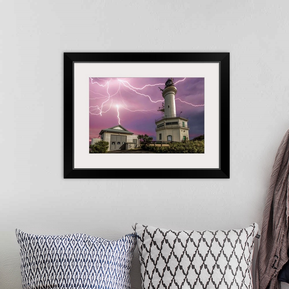 A bohemian room featuring Lightning strikes over the lighthouse at Point Lonsdale, Victoria, Australia.