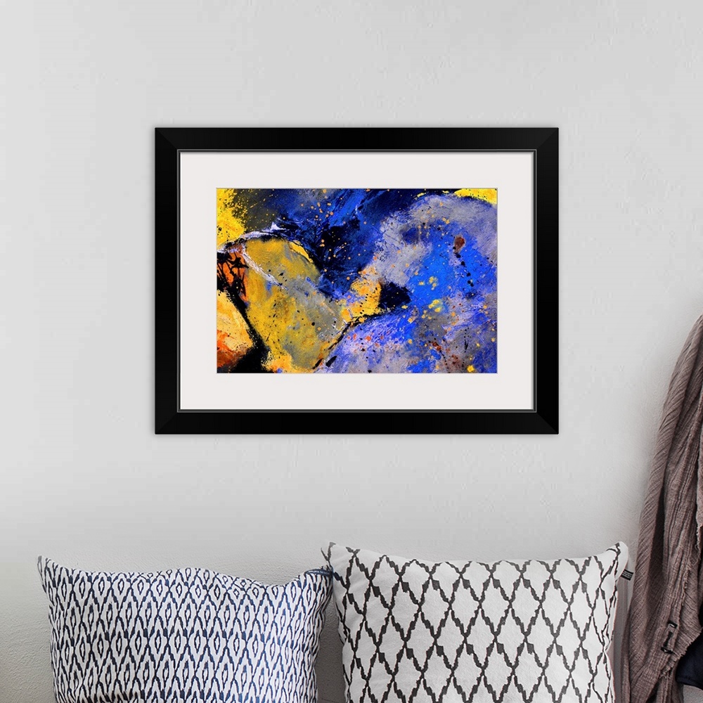 A bohemian room featuring Abstract painting in dark shades of black, blue, white and yellow with splatters of paint overlap...