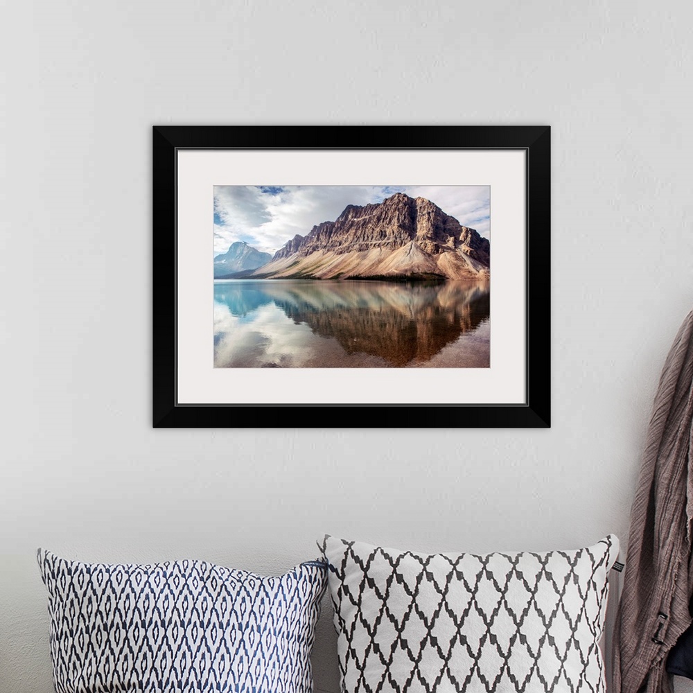 A bohemian room featuring Crowfoot Mountain reflected in Bow Lake located in Banff National Park, Alberta, Canada.