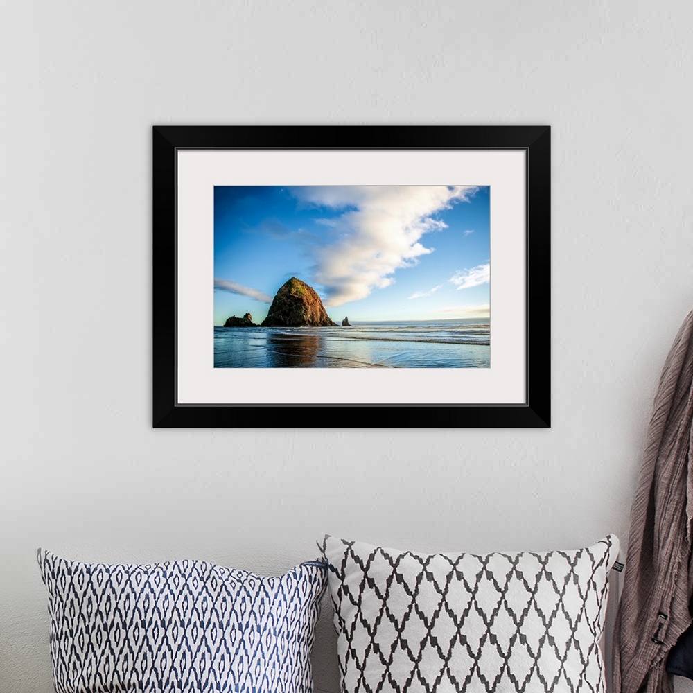 A bohemian room featuring Panoramic photograph of Haystack Rock at golden hour, just before sunset, Cannon Beach, Oregon.