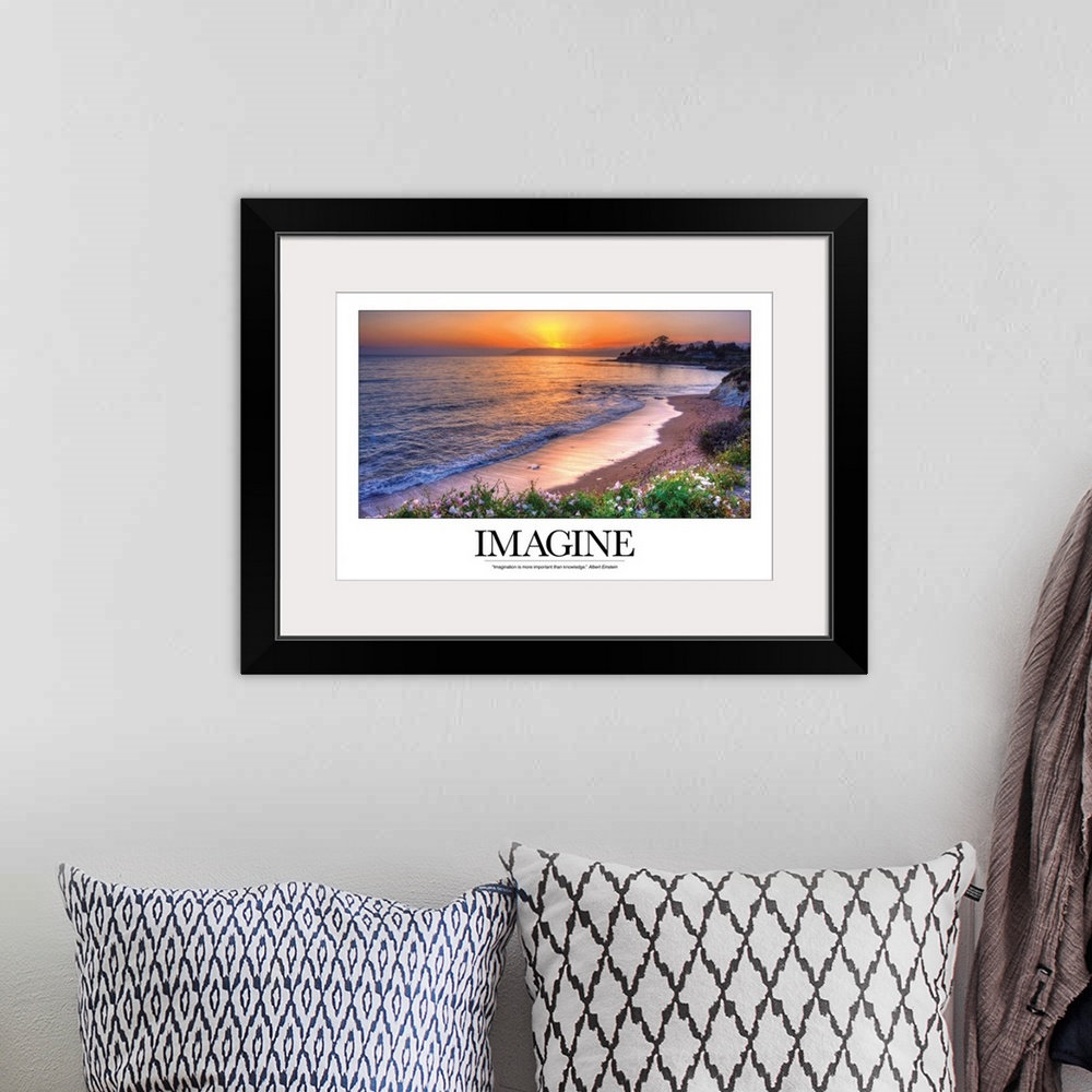A bohemian room featuring This photograph is taken of a sunset over the ocean and beach with the word Imagine written out b...