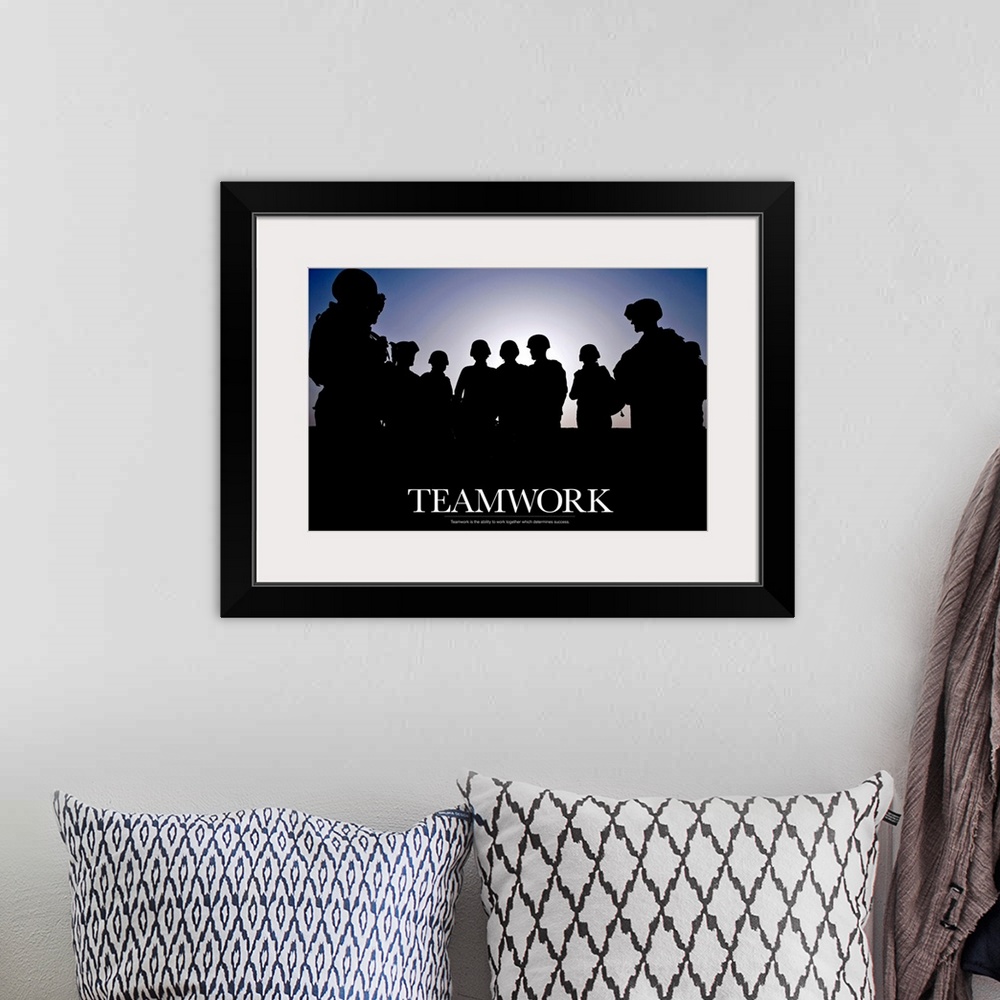A bohemian room featuring Giant photograph includes a silhouetted group of soldiers that has an inspirational message for t...
