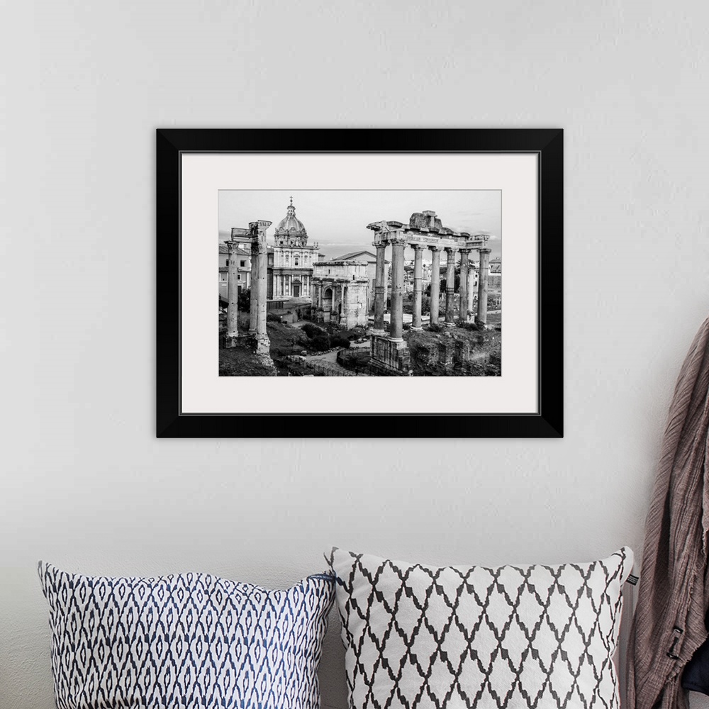 A bohemian room featuring Black and White photograph of the ruins at the Roman Forum.