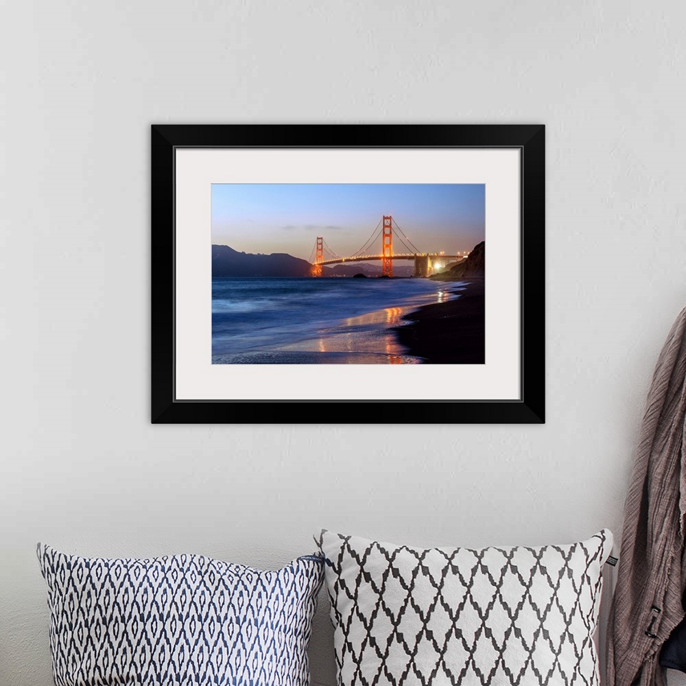 A bohemian room featuring Twilight photograph of the Golden Gate Bridge taken from the shore.