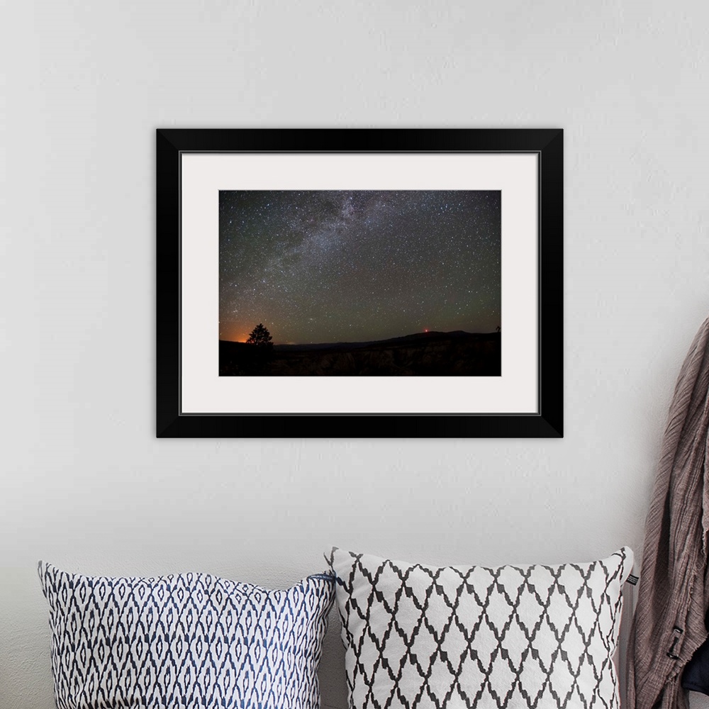 A bohemian room featuring Silhouette photograph of Zion National Park at night time with a starry sky above.