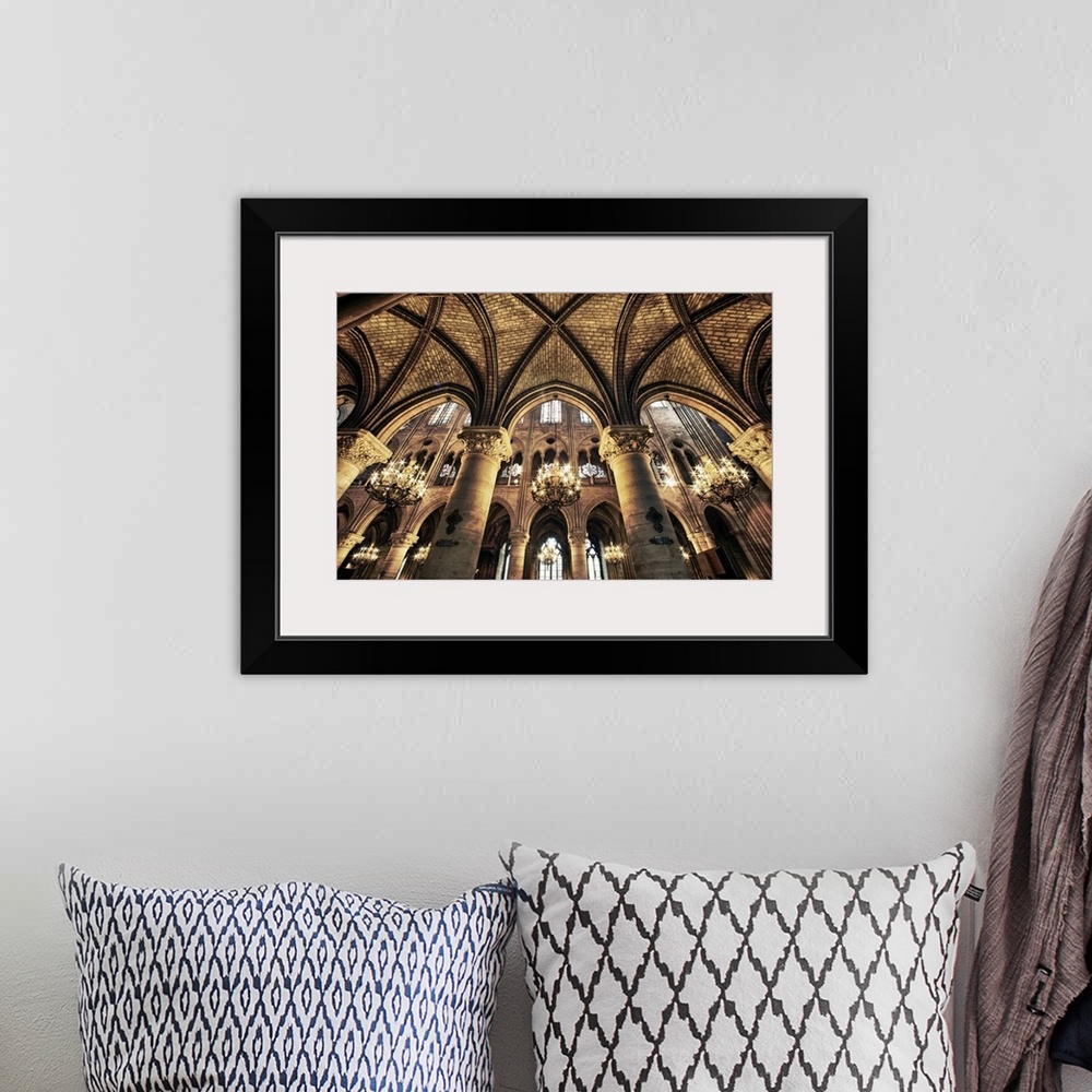 A bohemian room featuring This photograph is taken inside of the Notre Dame Cathedral looking up at the beautiful arch ceil...