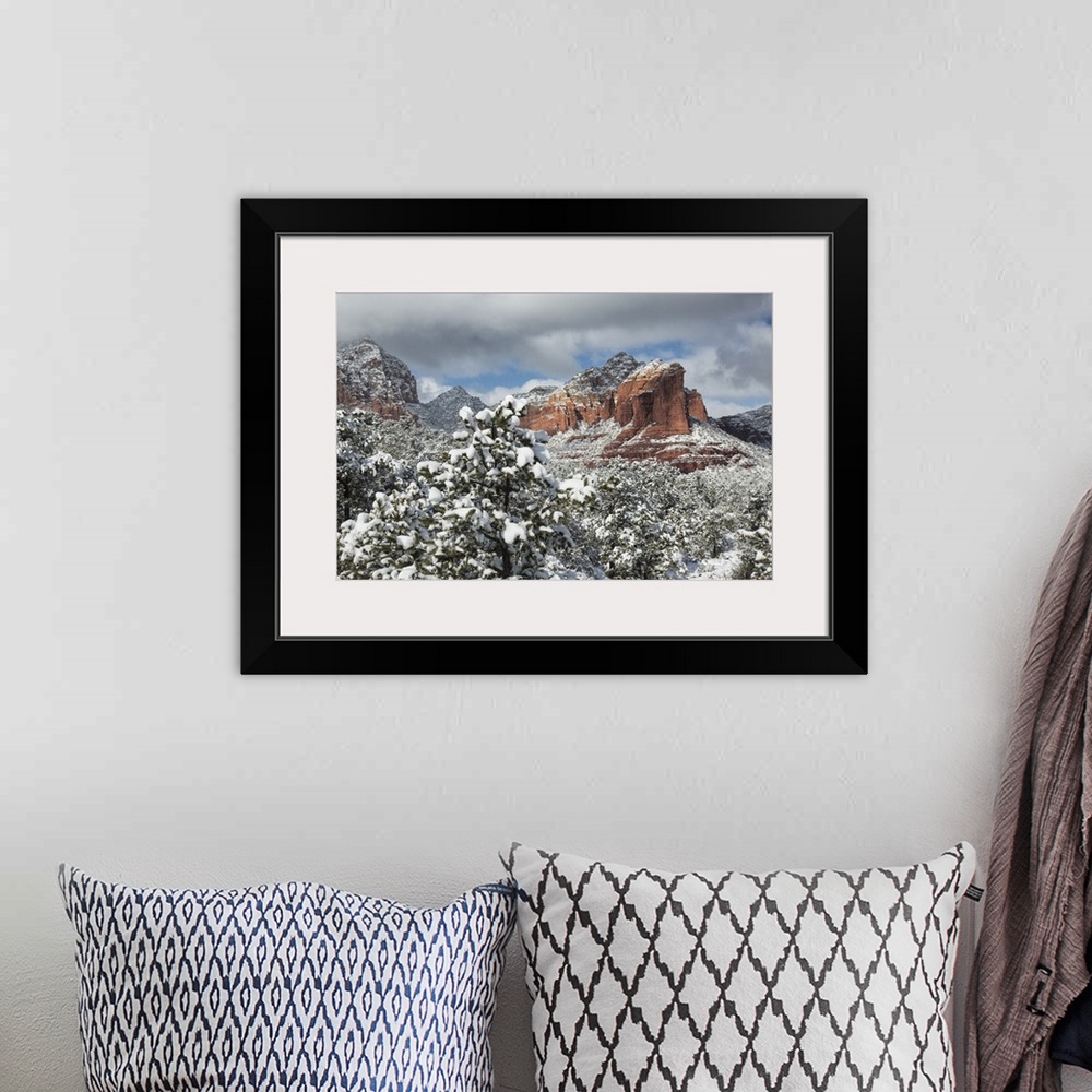 A bohemian room featuring The red rocks of Sedona, Arizona covered in snow.