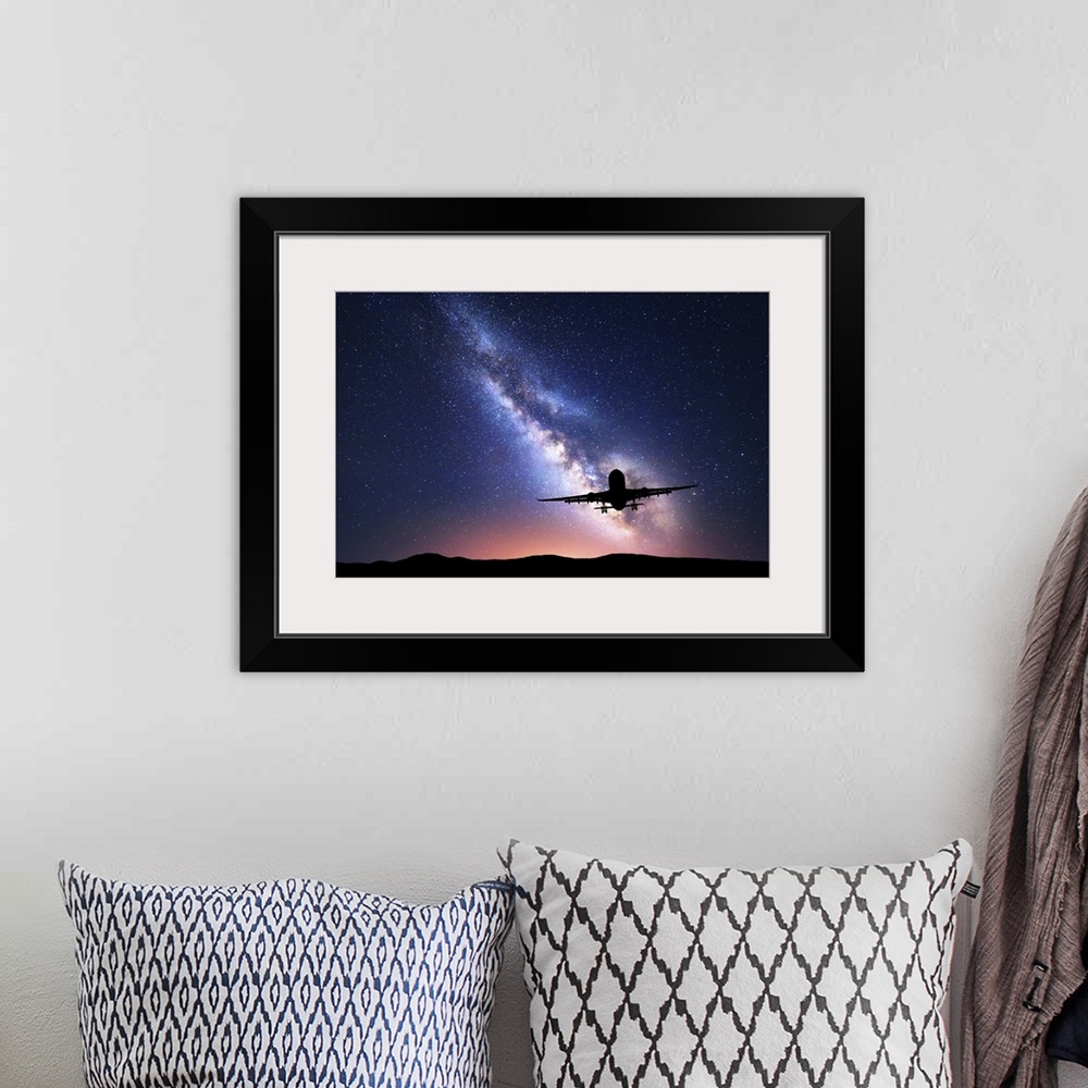 A bohemian room featuring Milky Way And Silhouette Of A Airplane