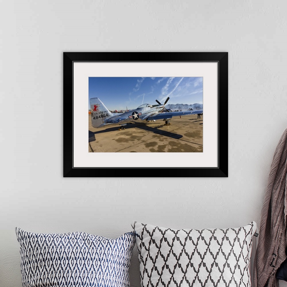 A bohemian room featuring A P-51 Mustang parked on the ramp at Nellis Air Force Base, Nevada.