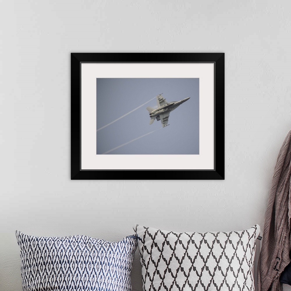 A bohemian room featuring August 22, 2013 - An F/A-18E Super Hornet in flight over the Gulf of Oman.