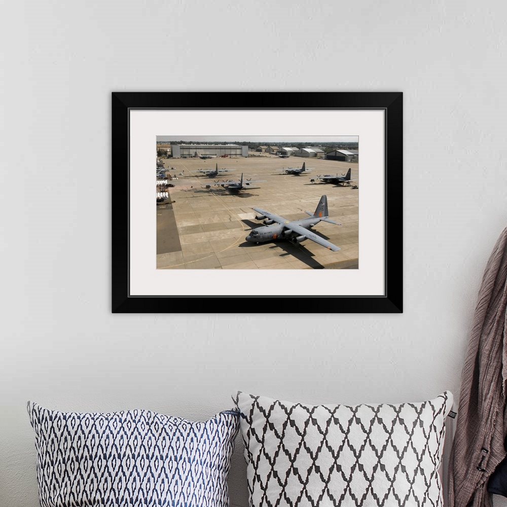 A bohemian room featuring C130 Hercules aircraft stationed at an airbase
