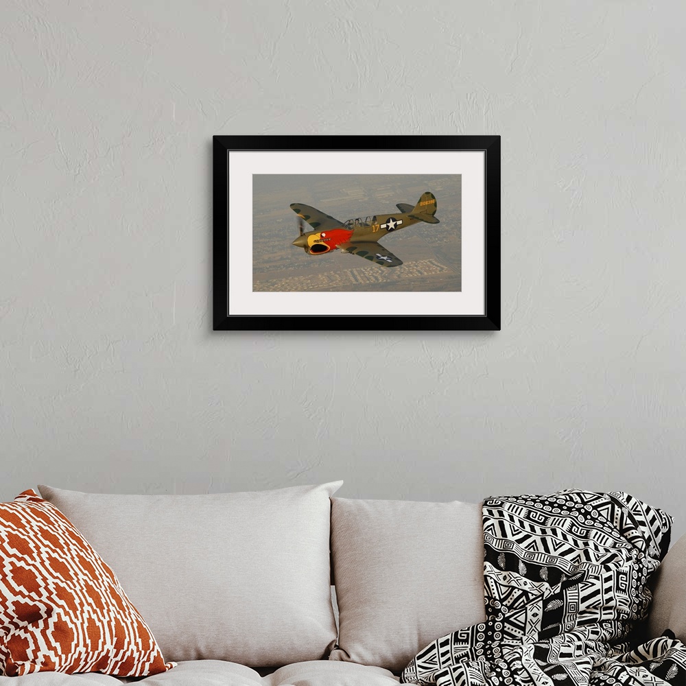 A bohemian room featuring P-40 Warhawk flying over Chino, California.