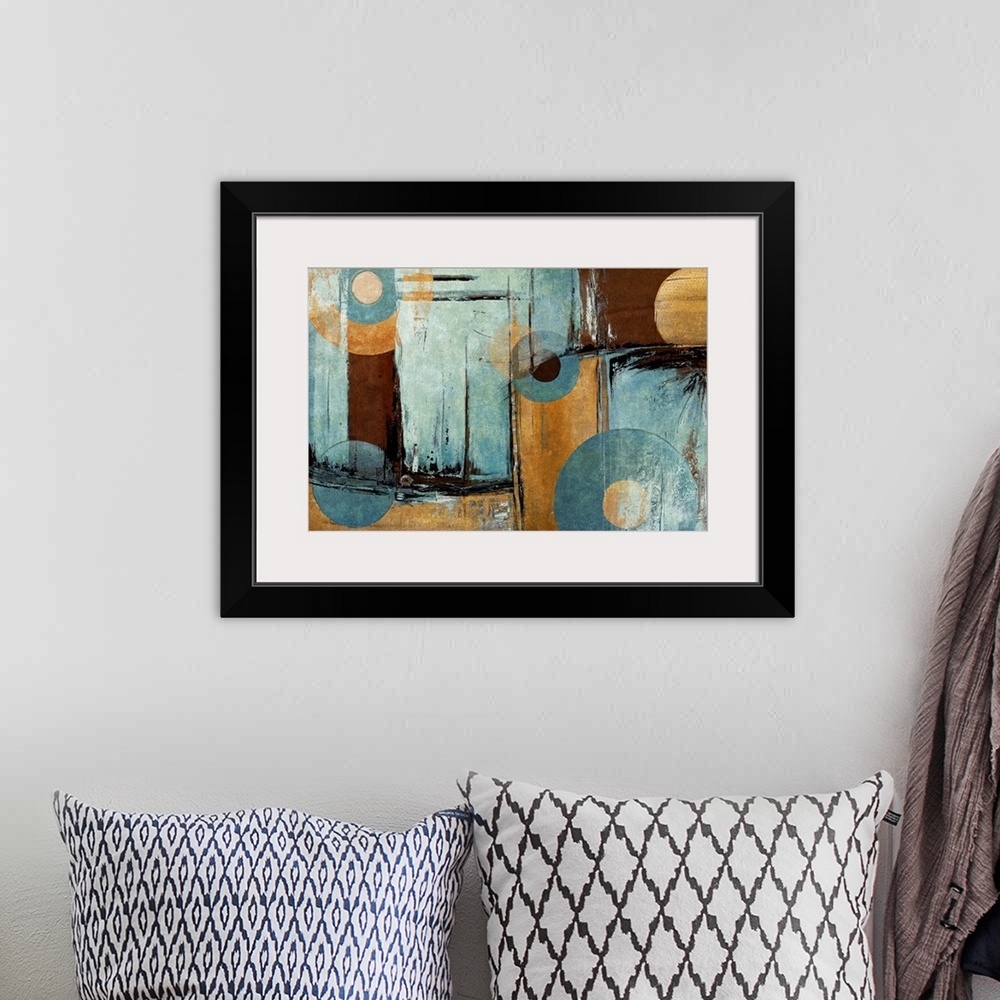 A bohemian room featuring Giant abstract art composed of different distressed rectangular patches of earth toned colors.  O...