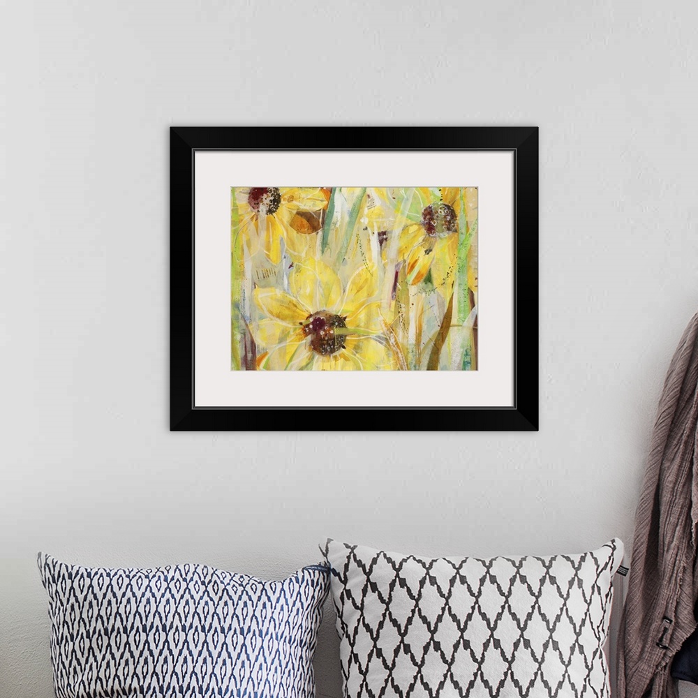 A bohemian room featuring A contemporary painting of a close view of yellow flowers.
