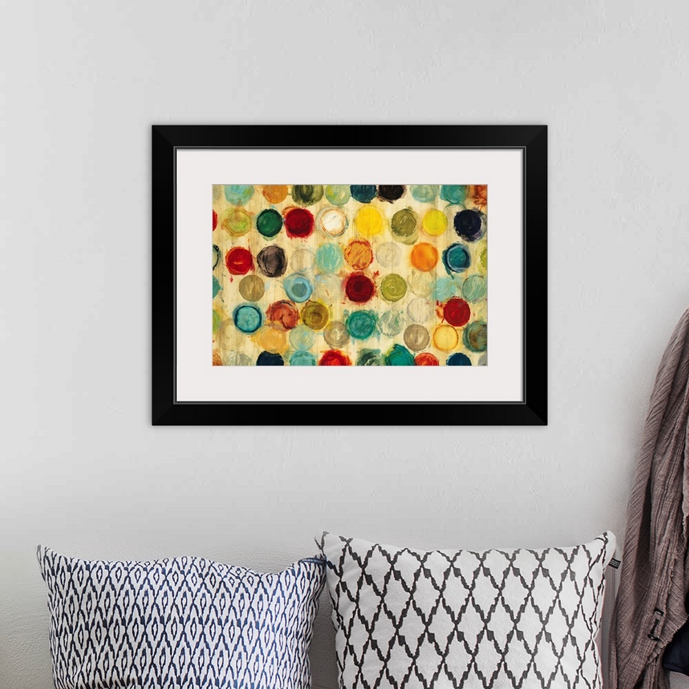 A bohemian room featuring Abstract artwork of a collection of multicolored circles, all of the same size, arranged in semi-...
