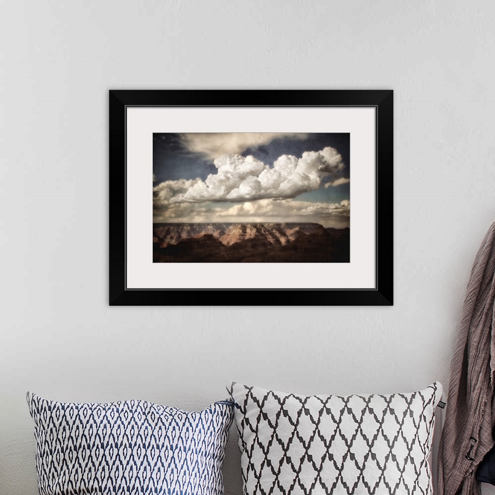 A bohemian room featuring Huge canyon in the background looking across the Grand Canyon in USA with clouds in a blue summer...