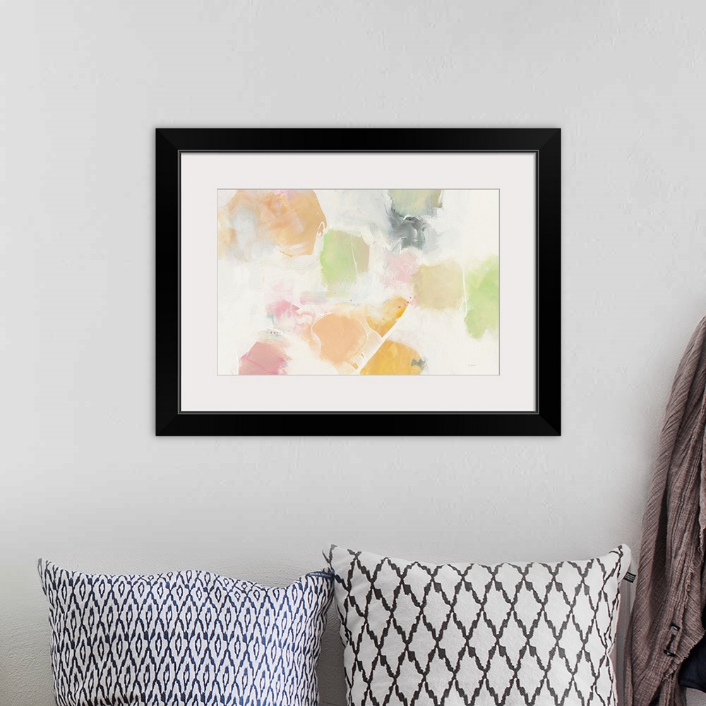 A bohemian room featuring Large abstract art with soft blotches of green, pink, orange, and yellow hues on a grey and white...