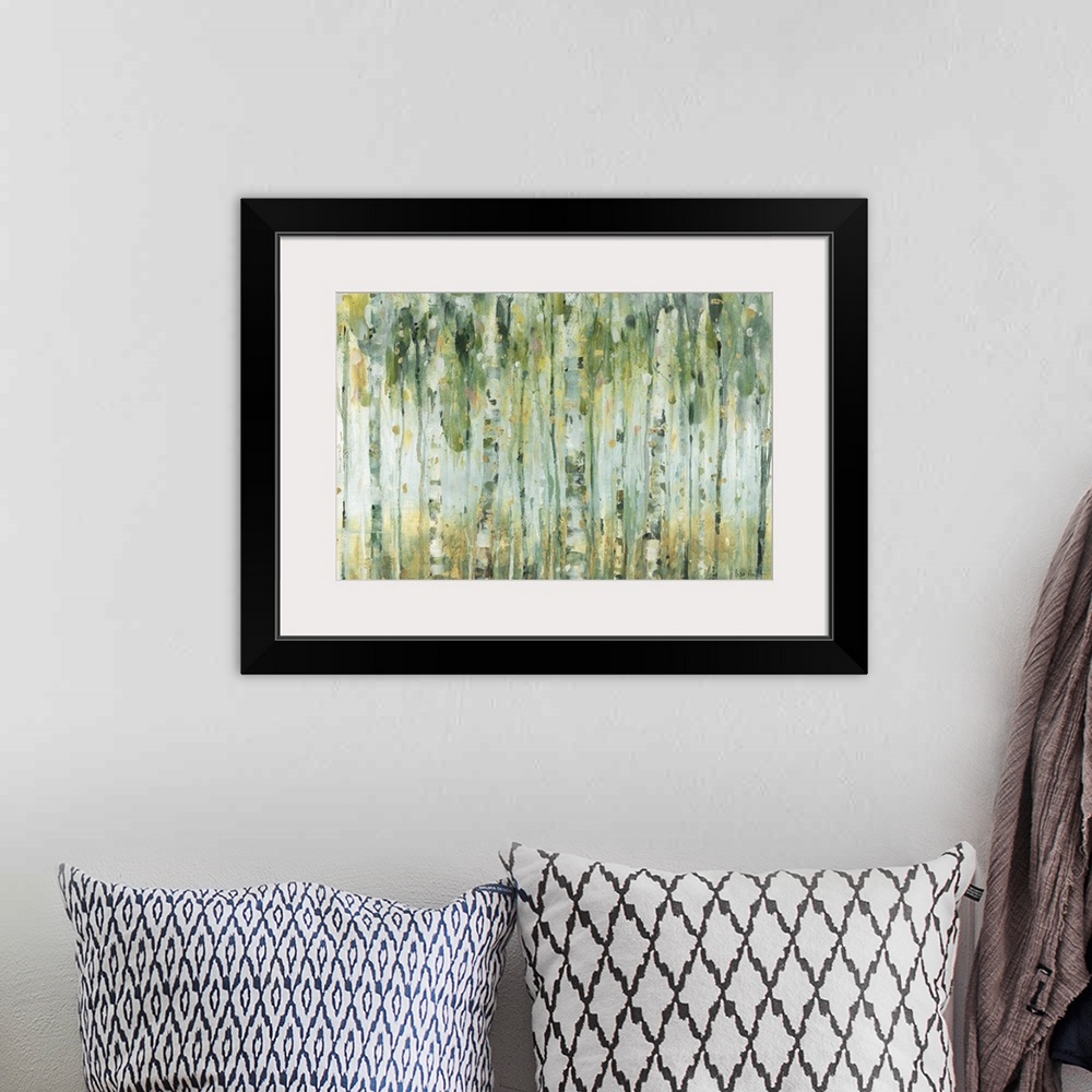 A bohemian room featuring Horizontal contemporary abstract painting with lines of green, blue, yellow, and gold hues runnin...