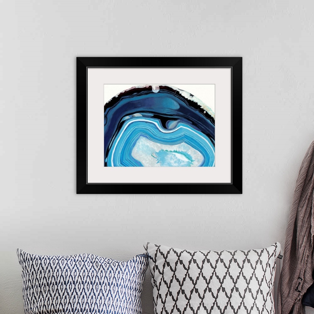 A bohemian room featuring Contemporary painting of a cross section of mineral agate in bright blue.