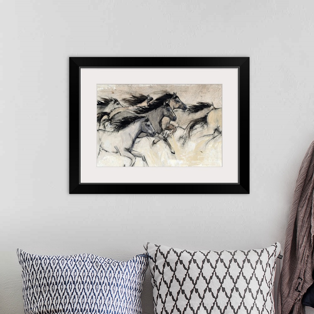 A bohemian room featuring Contemporary artwork of a herd of horses galloping at fast pace.