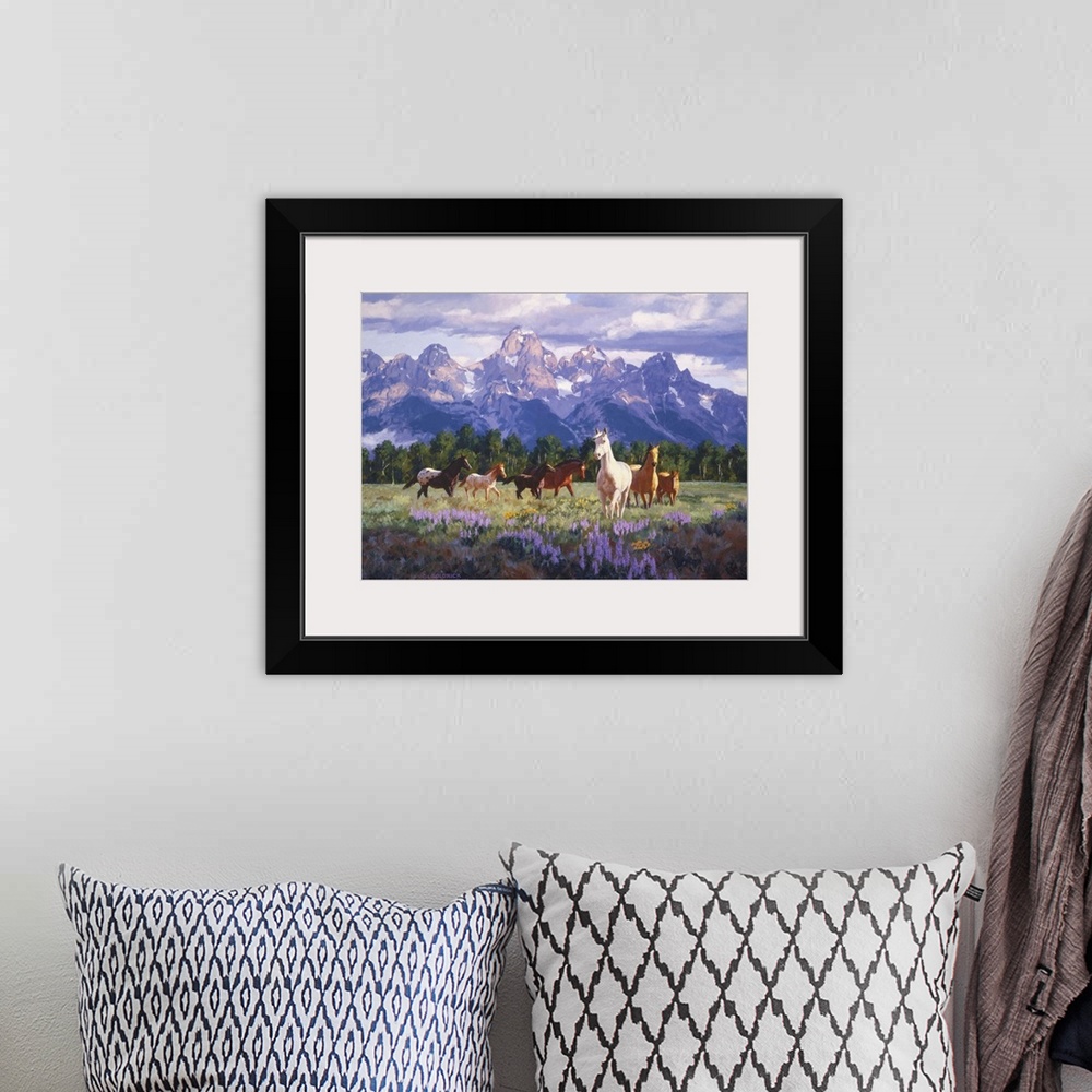 A bohemian room featuring Contemporary colorful painting of a herd of horses in a countryside clearing, with mountains in t...
