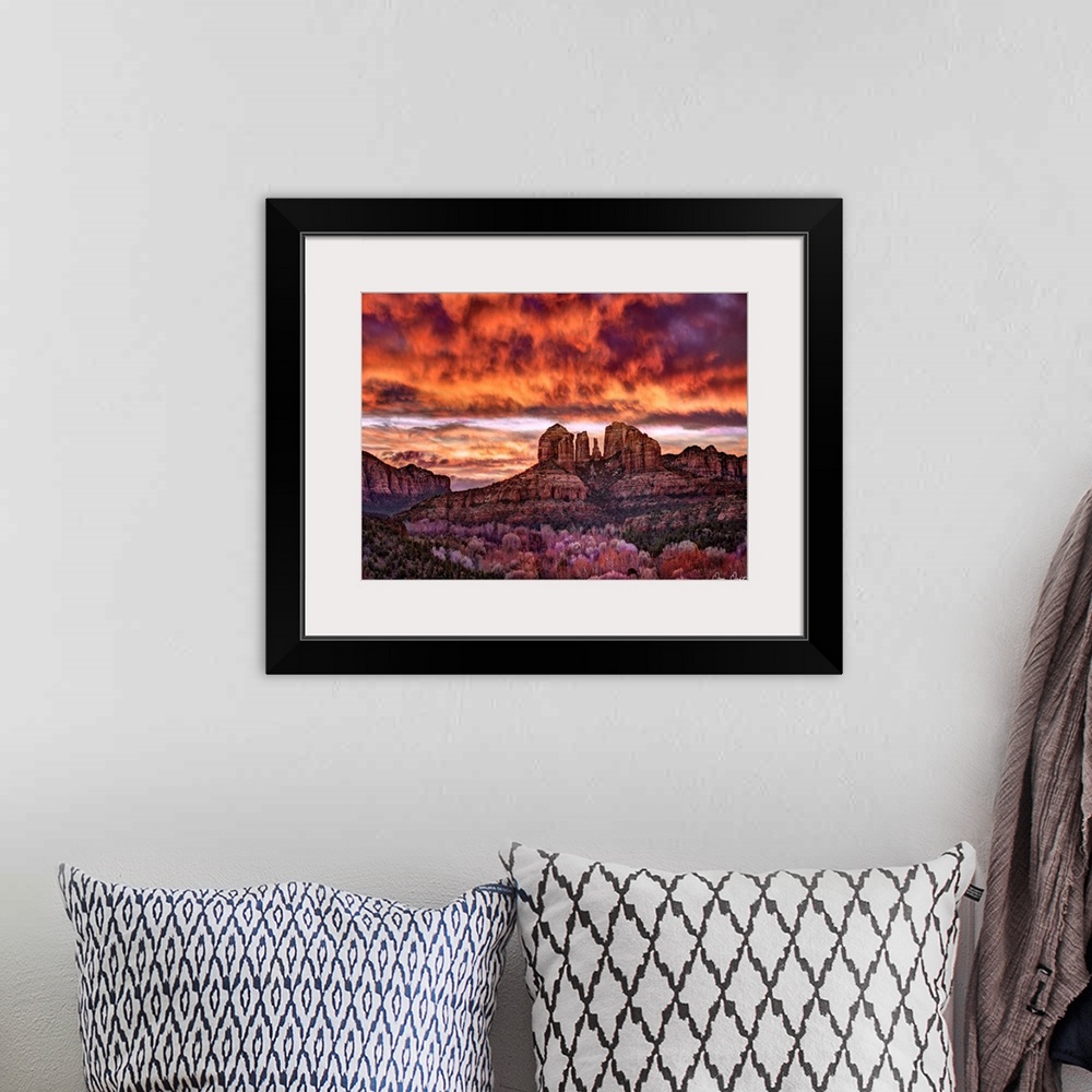 A bohemian room featuring High definition photograph of sandstone canyons with a fire sky above.