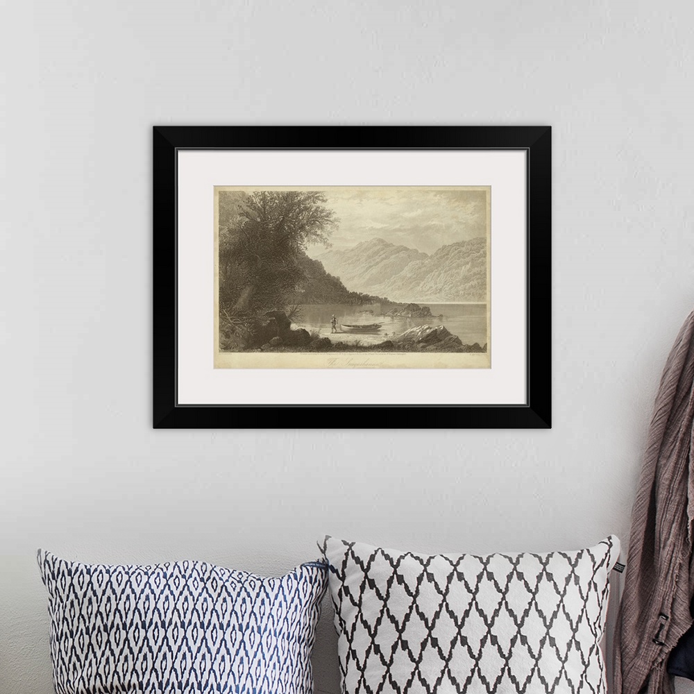 A bohemian room featuring Vintage artwork of a lake by the mountains in sepia.