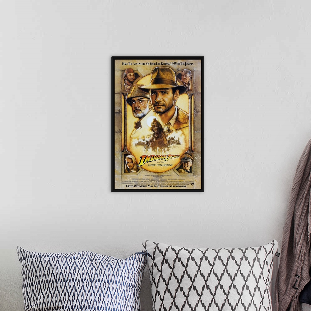A bohemian room featuring Movie poster advertising the 1989 classic family favorite movie, Indiana Jones and the Last Crusa...