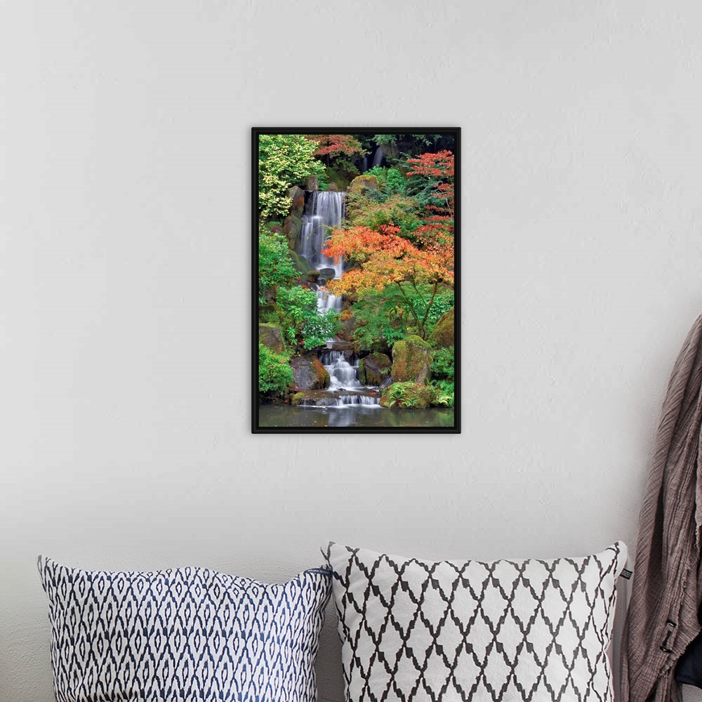 A bohemian room featuring Photograph of waterfall surrounded by autumn trees.