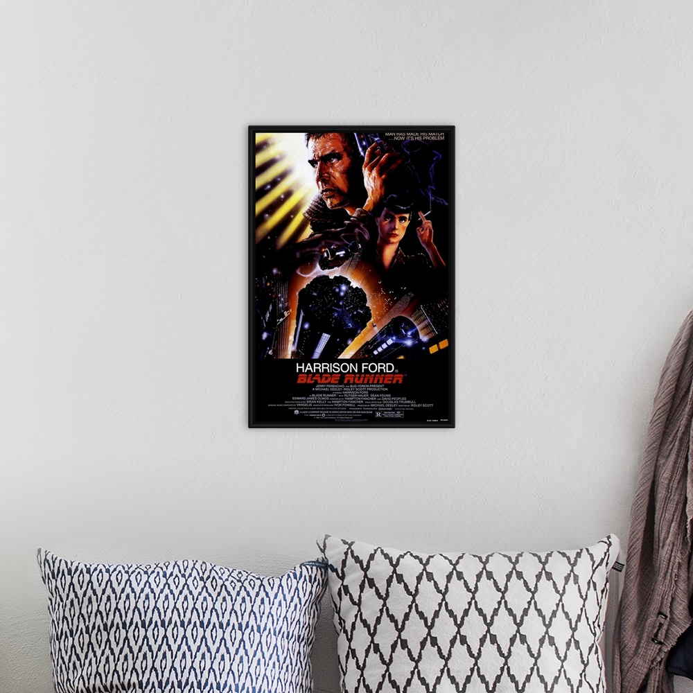 A bohemian room featuring Big, vertical movie advertisement for Blade Runner, with a profile headshot of Harrison Ford at t...
