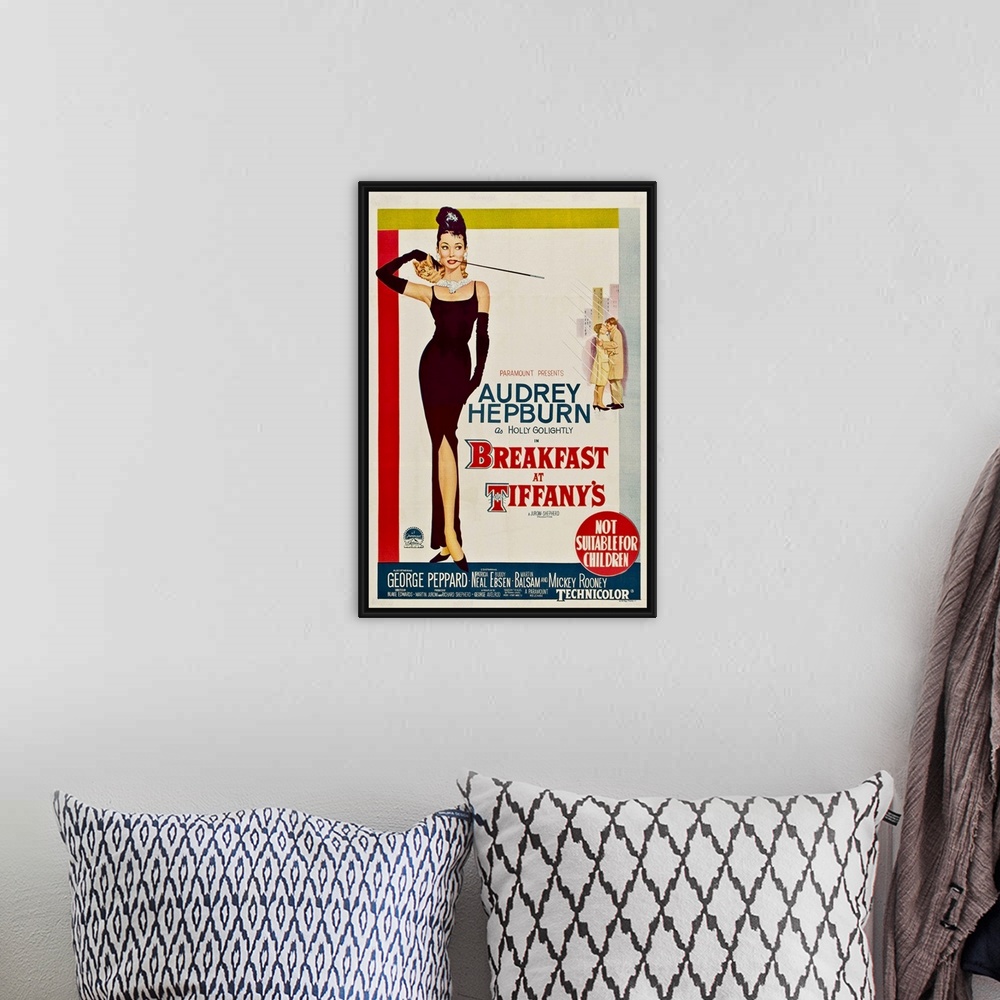 A bohemian room featuring Vertical, large vintage advertisement for the movie "Breakfast At Tiffany's", with actress Audrey...