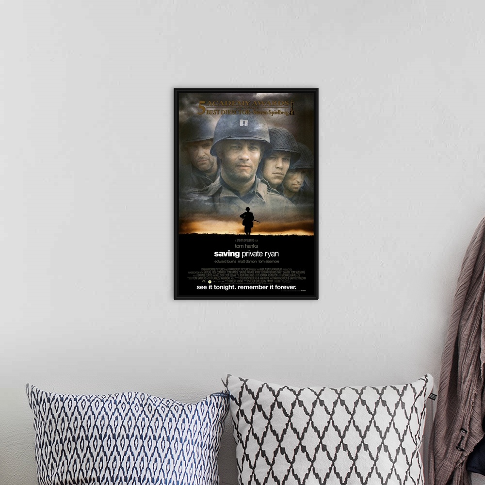 A bohemian room featuring The classic movie poster for "Saving Private Ryan". There is a faded picture of the four main cha...
