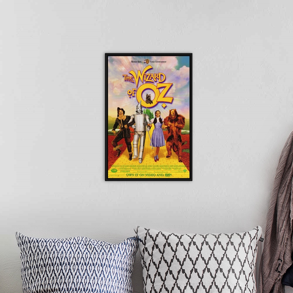A bohemian room featuring Wall art of a classic movie with the Scarecrow, Tin man, Dorothy and the Cowardly Lion walking do...