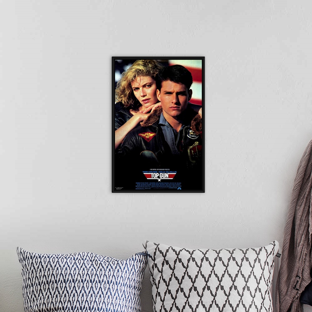 A bohemian room featuring Movie poster for the hit film "Top Gun". Tom Cruise and his love interest are shown on the poster.