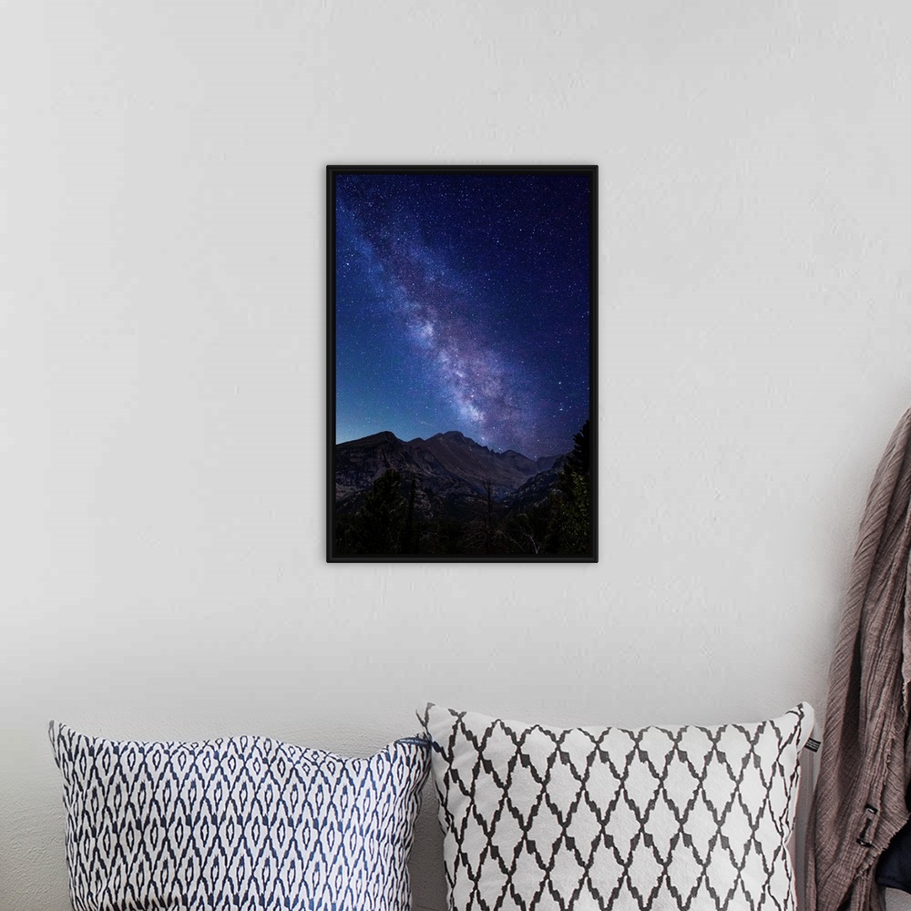 A bohemian room featuring Photograph of the milky way over the Rocky Mountains in Rocky Mountain National Park.