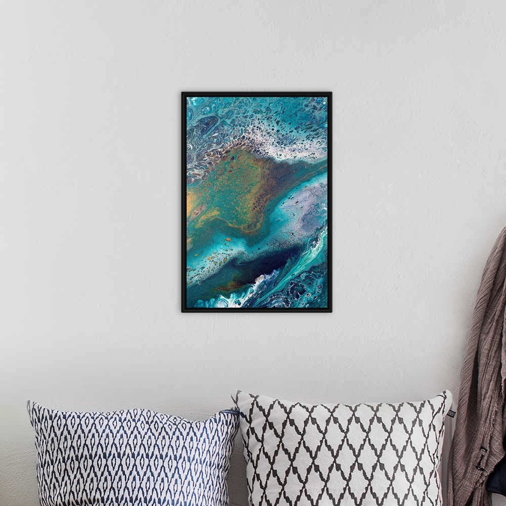 A bohemian room featuring Abstract contemporary painting in color tones resembling the ocean, applied in a marbling effect.