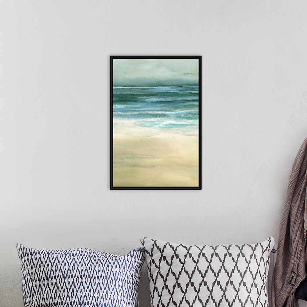 A bohemian room featuring Beautiful artwork of a seascape that uses duller colors to paint the ocean and sand.