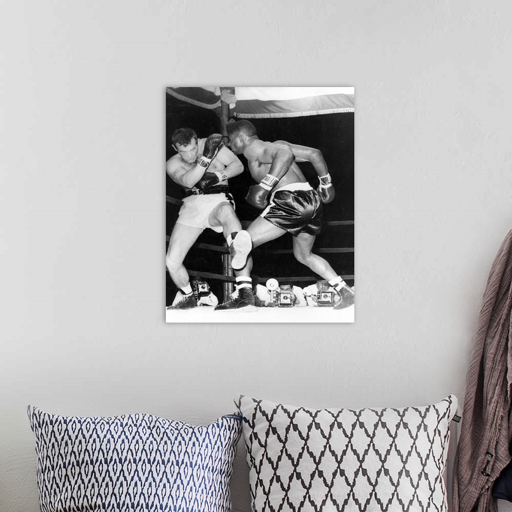 A bohemian room featuring Floyd Patterson of the USA, fighting Ingemar Johansson of Sweden in New York