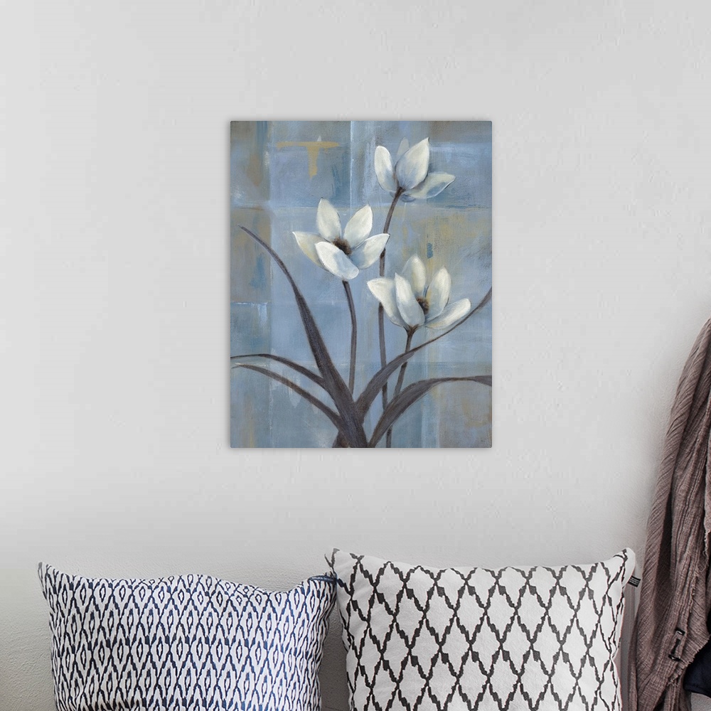A bohemian room featuring Contemporary painting of three white tulips and slender leaves and stems.